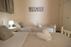 Ένα ή περισσότερα κρεβάτια σε δωμάτιο στο Evillion