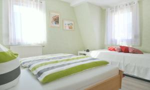 Postel nebo postele na pokoji v ubytování Ferienwohnung Bodenstein