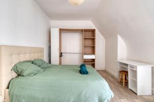 Giường trong phòng chung tại Le Nid - Place Imbach +3 ảnh