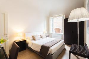 Voodi või voodid majutusasutuse Borgo Suite Apartment toas
