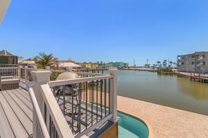 a balcony with a view of the water at 920 Bay Breeze Bungalow- Stunning Bay View Home with Heated Pool! home in Fort Myers Beach