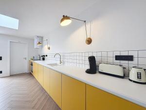 Kuchyň nebo kuchyňský kout v ubytování Maison Martha in Oostduinkerke