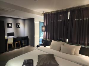 Postel nebo postele na pokoji v ubytování Hotel Yaja Sasang Terminal