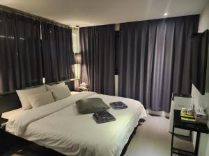 Postel nebo postele na pokoji v ubytování Hotel Yaja Sasang Terminal
