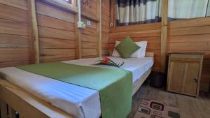 Postel nebo postele na pokoji v ubytování Ocean bliss hiriketiya