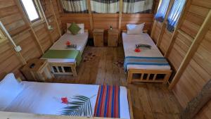 Postel nebo postele na pokoji v ubytování Ocean bliss hiriketiya