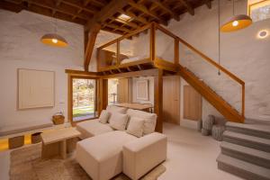 a living room with a couch and a staircase at Redondo de Guayedra in Guayedra