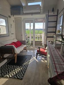Postel nebo postele na pokoji v ubytování Tiny House