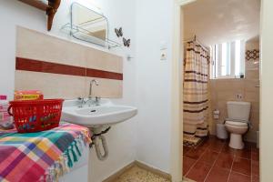 a bathroom with a sink and a toilet at Chania Vintage Escape - sea view Gem by old port in Chania Town +44 photos