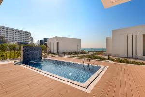 Bazén v ubytování Ajman Hotel & Villas by Blazon Hotels nebo v jeho okolí