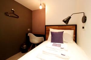 Postel nebo postele na pokoji v ubytování Daan Park Hotel