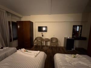 Postel nebo postele na pokoji v ubytování Lorenda palace hotel