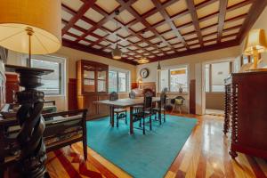 a living room with a table and chairs and a dining room at Boutique Suites by Hosty in Porto