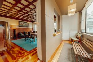 a dining room and living room with a table and chairs at Boutique Suites by Hosty in Porto