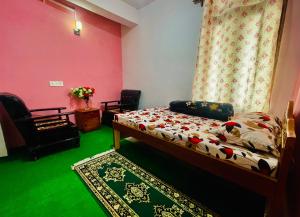 a bedroom with a bed and a chair and a rug at Mountain View homestay in Darjeeling