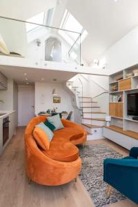 a living room with a brown couch in a room at Stylish cottage in Bembridge in Bembridge