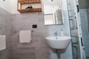 a bathroom with a sink and a mirror at Casa Malika a Otranto in Otranto +88 photos