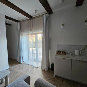 Posezení v ubytování Krzywa Apartamenty