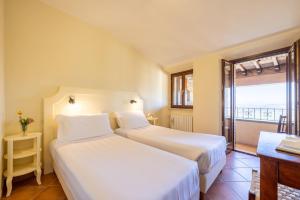 Postel nebo postele na pokoji v ubytování Hotel Monastero Sant'Andrea