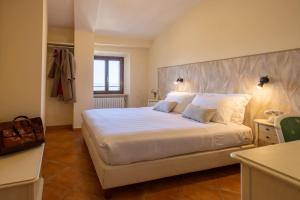 Postel nebo postele na pokoji v ubytování Hotel Monastero Sant'Andrea