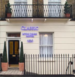 a blue and white building with a blue door at Classic Hyde Park Hotel in London