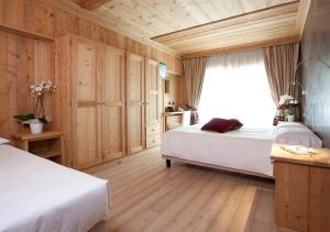 Postel nebo postele na pokoji v ubytování Hotel Funivia