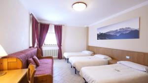 Postel nebo postele na pokoji v ubytování Albergo Ristoro Sitten - 2300 mt
