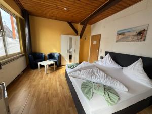Postel nebo postele na pokoji v ubytování Hotel-Restaurant Christine