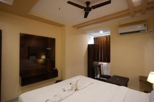 Hotel Blissful客房内的一张或多张床位