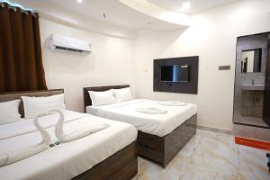 Hotel Blissful客房内的一张或多张床位