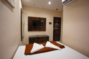 Hotel Blissful客房内的一张或多张床位