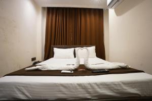 Hotel Blissful客房内的一张或多张床位