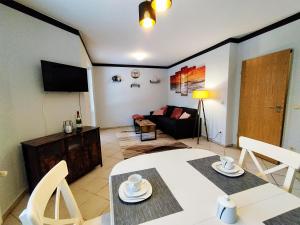 TV a/nebo společenská místnost v ubytování Ferienwohnungen im Haus Boddenruh