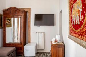 TV a/nebo společenská místnost v ubytování Bari LandLord