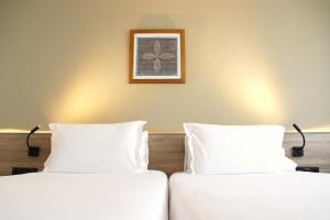Postel nebo postele na pokoji v ubytování Eurohotel Diagonal Port