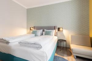 Postel nebo postele na pokoji v ubytování Garner Hotel Vienna by IHG