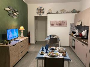 a kitchen with a table with food on it at La Rosa Blu in San Vito lo Capo