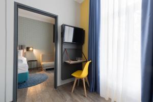 Postel nebo postele na pokoji v ubytování Garner Hotel Vienna by IHG