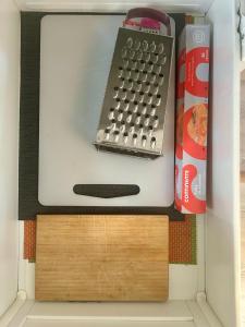 a keyboard and a book in a refrigerator at Studio Polvo in Parede