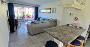 a living room with a couch and a table at 26 Le Paradis in Ballito