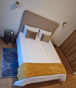 Un ou plusieurs lits dans un hébergement de l'établissement Appartement Domaine de Noria