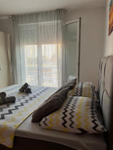 Postel nebo postele na pokoji v ubytování Studio Apartman Karlo