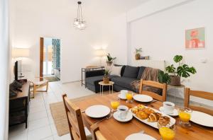 a living room with a table with food on it at Coastal Key 5 in Gázion