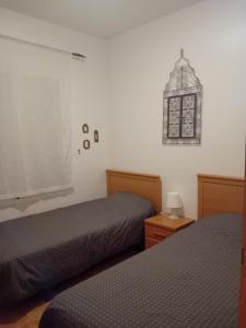 Postel nebo postele na pokoji v ubytování Casa el Olivo