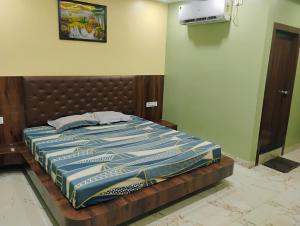 a bed sitting in a room with at Umas Regency in Guwahati