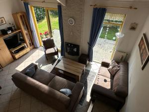 a living room with a couch and a table at Albatros 327 in Julianadorp