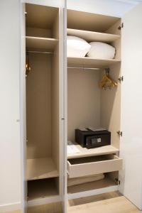 a walk in closet with a printer in it at Hotel Albufera in Alfafar