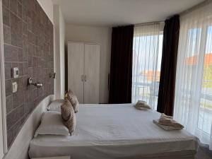 Кровать или кровати в номере Complex Pika