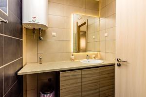 a bathroom with a sink and a mirror at Sea View Apartments Perovic in Budva +42 photos
