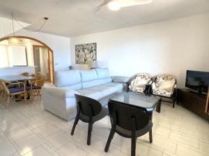 a living room with a couch and a table at Spanish Connection - Villa Morena in La Manga del Mar Menor